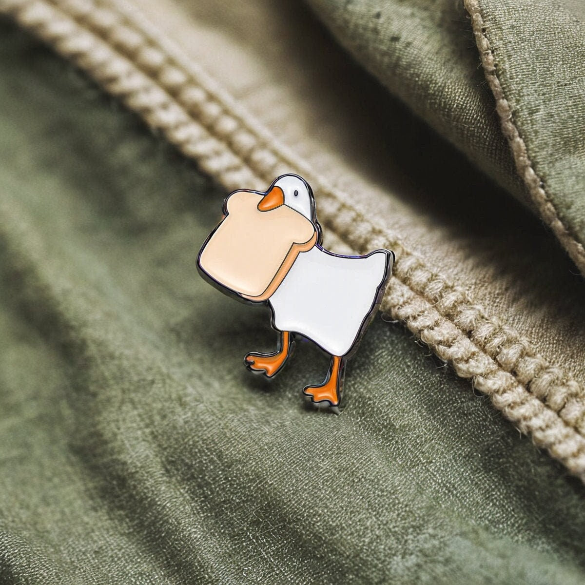 Toast-Thief Duck Enamel Pin - Charming Bread-Loving Duck Accessory for Casual Fun